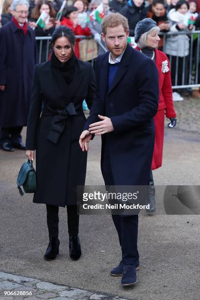 Prince Harry and Meghan Markle during a walkabout at Cardiff Castle on January 18, 2018 in Cardiff, Wales.