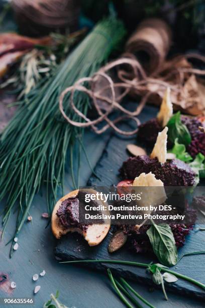 olive tapenade served with tortilla chips and green  and dry spices - wild leek stock pictures, royalty-free photos & images