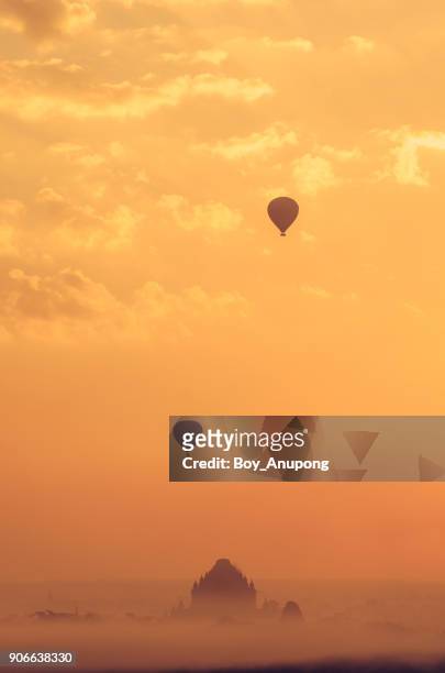 the beautiful scenery view of hot air balloons flying over sulamani temple one of the most beautiful pagoda in bagan during the sunrise in myanmar. the pagoda damaged after the big earthquake 2016. - bagan temples damaged in myanmar earthquake stock pictures, royalty-free photos & images
