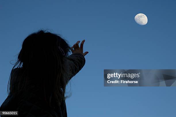 girl and the moon - girl pointing bildbanksfoton och bilder