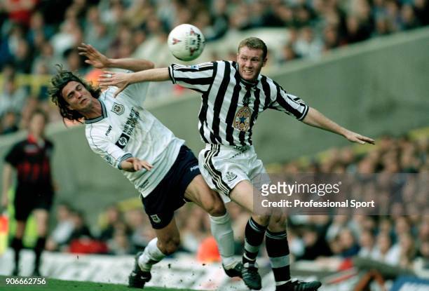 Steve Watson of Newcastle United and David Ginola of Tottenham Hotspur in action during the FA Carling Premiership match at White Hart Lane on April...