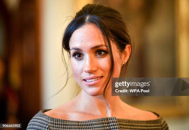 Meghan Markle chats with people inside the Drawing Room during a visit to Cardiff Castle on January 18, 2018 in Cardiff, Wales.