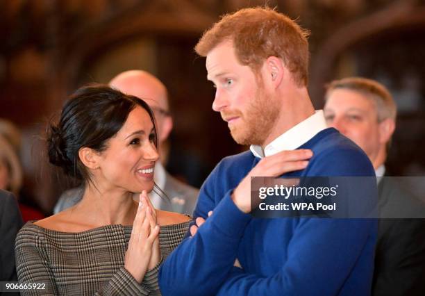 Prince Harry and Meghan Markle watch a dance performance by Jukebox Collective in the banqueting hall during a visit to Cardiff Castle on January 18,...