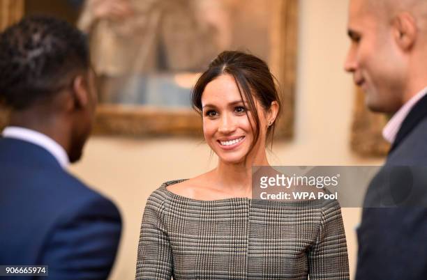 Meghan Markle chats with people inside the Drawing Room during a visit to Cardiff Castle on January 18, 2018 in Cardiff, Wales.
