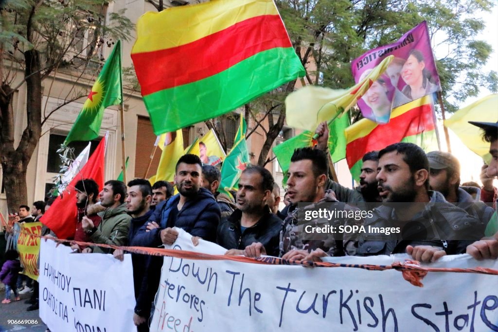Kurdish demonstrators shout slogans and wave Kurdish flags...
