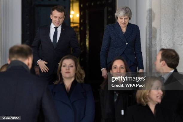 Prime Minister Theresa May and French President Emmanuel Macron attend a 'family photograph' at the Royal Military Academy Sandhurst on January 18,...