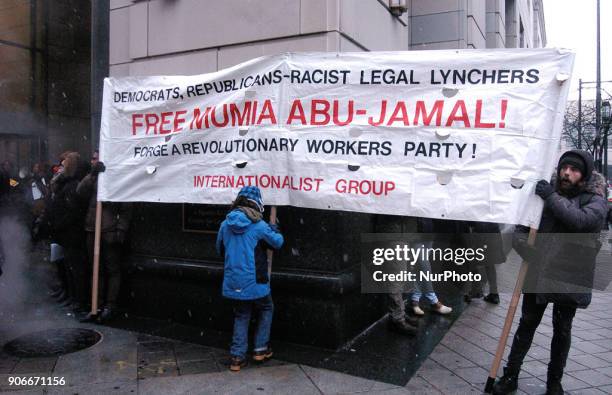 Protesters rally for the release of Mumia Abu-Jamal in front of the Philadelphia Criminal Justice Center in Center City Philadelphia on January 17,...