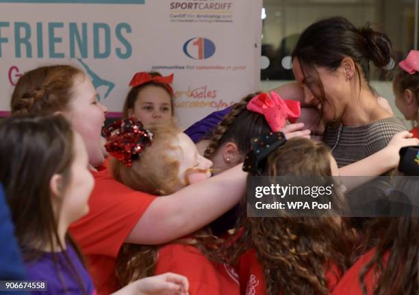 Meghan Markle in a group hug as she attends a street dance class during her visit to Star Hub on January 18, 2018 in Cardiff, Wales.