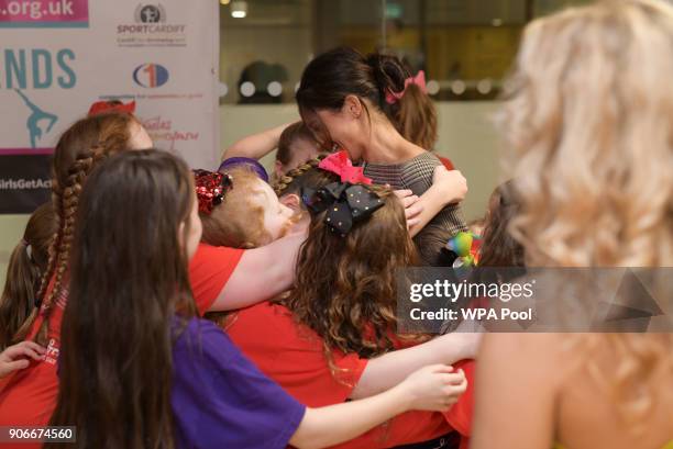 Meghan Markle in a group hug as she attends a street dance class during her visit to Star Hub on January 18, 2018 in Cardiff, Wales.