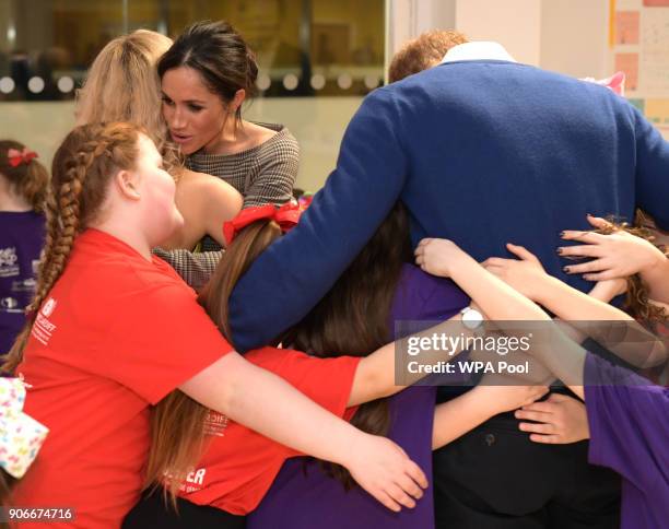 Prince Harry and his fiancee Meghan Markle attend a street dance class during their visit to Star Hub on January 18, 2018 in Cardiff, Wales.