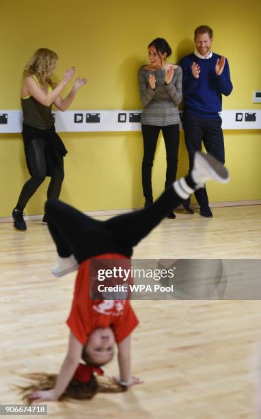 Prince Harry and his fiancee Meghan Markle attend a street dance class during their visit to Star Hub on January 18, 2018 in Cardiff, Wales.