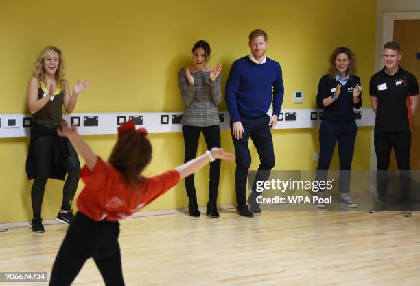 Prince Harry and his fiancee Meghan Markle attend a street dance class during their visit to Star Hub on January 18, 2018 in Cardiff, Wales.