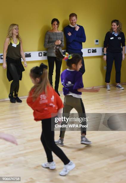 Prince Harry and his fiancee Meghan Markle attend a street dance class during their visit to Star Hub on January 18, 2018 in Cardiff, Wales.