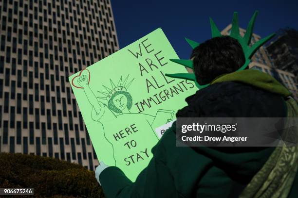 Immigration activists and clergy members participate in a silent prayer walk in protest against the Trump administration's immigration policies...