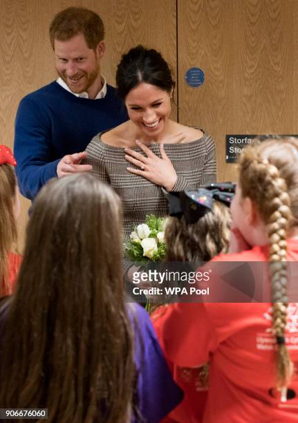 Prince Harry and his fiancee Meghan Markle attend a street dance class during their visit to Star Hub on January 18, 2018 in Cardiff, Wales.
