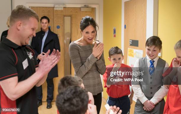 Prince Harry and his fiancee Meghan Markle attend a street dance class during their visit to Star Hub on January 18, 2018 in Cardiff, Wales.