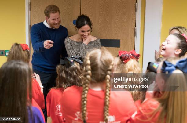 Prince Harry and his fiancee Meghan Markle attend a street dance class during their visit to Star Hub on January 18, 2018 in Cardiff, Wales.