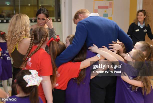 Prince Harry and his fiancee Meghan Markle attend a street dance class during their visit to Star Hub on January 18, 2018 in Cardiff, Wales.