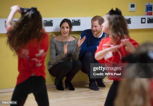 Prince Harry and his fiancee Meghan Markle attend a street dance class during their visit to Star Hub on January 18, 2018 in Cardiff, Wales.