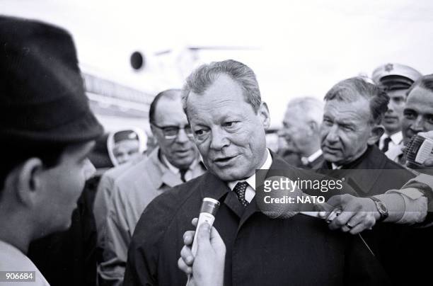 The German Chancellor Willy Brandt speaks to reporters after a meeting of the North Atlantic Council that reviewed the measures affecting access...