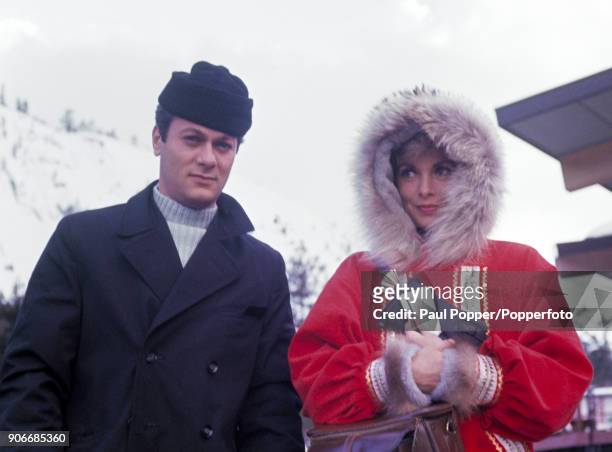 American actor Tony Curtis with his wife, the American actress Janet Leigh posing as they arrive at the Blyth Memorial Arena to watch events at the...