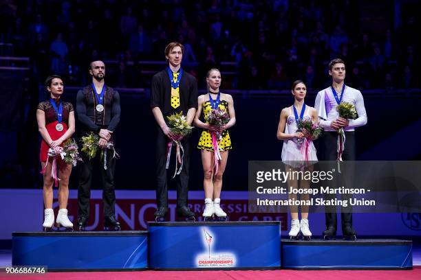 Ksenia Stolbova and Fedor Klimov, Evgenia Tarasova and Vladimir Morozov, Natalia Zabiiako and Alexander Enbert of Russia pose in the Pairs medal...