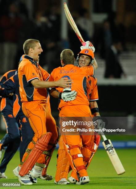 Netherlands batsmen Ryan ten Doeschate and Edgar Schiferli celebrate with Daan van Bunge after Netherlands win the ICC World Twenty20 group match...