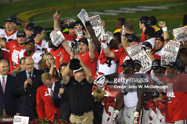 Rose Bowl: Georgia coach Kirby Smart victorious, holding up The Leishman Trophy after winning game vs Oklahoma at Rose Bowl Stadium. Pasadena, CA...