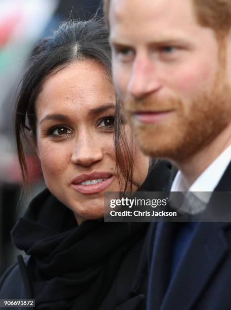 Prince Harry and fiance Meghan Markle during a walkabout at Cardiff Castle on January 18, 2018 in Cardiff, Wales.