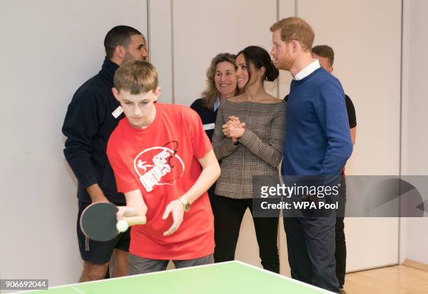 Prince Harry and Meghan Markle watch a game of table tennis during their visit to Star Hub on January 18, 2018 in Cardiff, Wales.