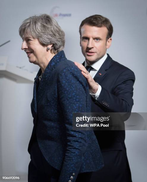 British Prime Minister Theresa May and French President Emmanuel Macron attend a press conference at the Royal Military Academy Sandhurst, after...