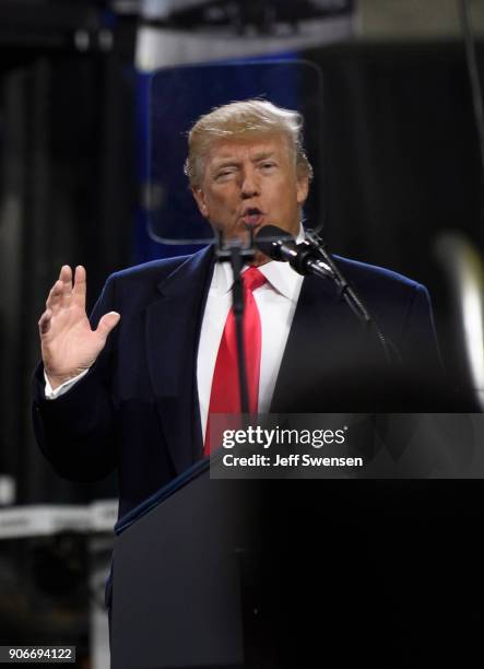 President Donald Trump speaks to supporters at a rally at H&K Equipment, a rental and sales company for specialized material handling solutions on...