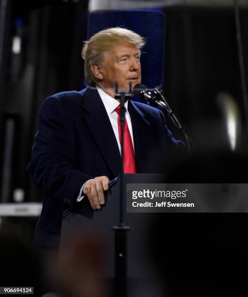 President Donald Trump speaks to supporters at a rally at H&K Equipment, a rental and sales company for specialized material handling solutions on...