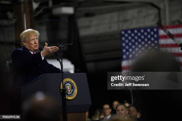 President Donald Trump speaks to supporters at a rally at H&K Equipment, a rental and sales company for specialized material handling solutions on...