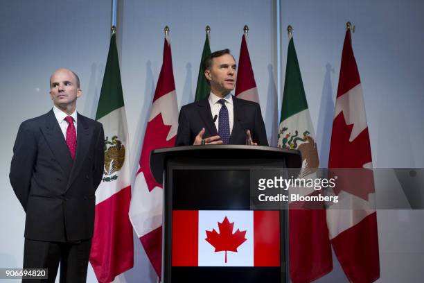 Bill Morneau, Canada's finance minister, right, speaks while Jose Antonio Gonzalez Anaya, Mexico's finance minister, listens during a joint news...