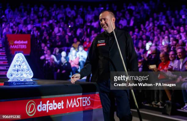 Mark Williams walks out for the start of his match against Kyren Wilson during day five of the 2018 Dafabet Masters at Alexandra Palace, London....
