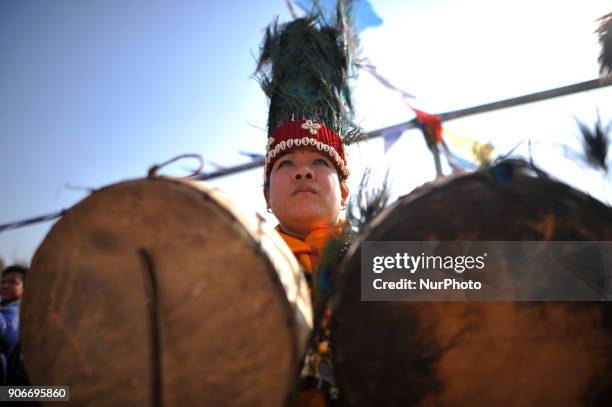 Nepalese people from Tamang community plays traditional instruments during celebration of Sonam Losar festival or Lunar New Year, which occurs around...