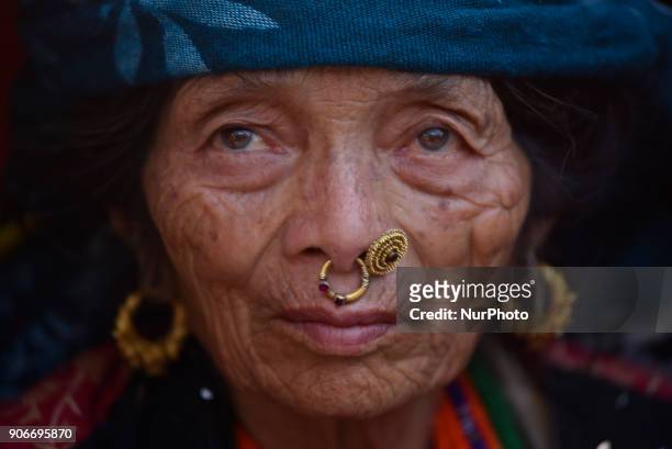 Portrait of an old woman come to participate in celebration of Sonam Losar festival or Lunar New Year, which occurs around the same time of year as...