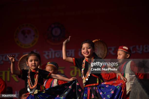 Tamang little kids performing cultural dance during celebration of Sonam Losar festival or Lunar New Year, which occurs around the same time of year...