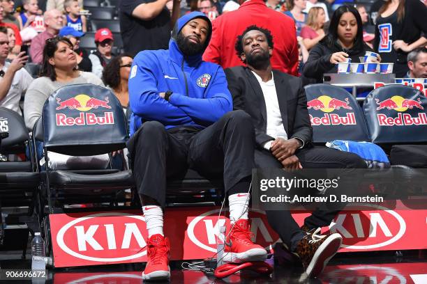 DeAndre Jordan and Patrick Beverley of the LA Clippers pose for a photo on the bench during the game against the Sacramento Kings on January 13, 2018...