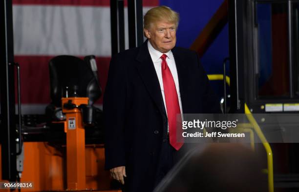 President Donald Trump speaks to supporters at a rally at H&K Equipment, a rental and sales company for specialized material handling solutions on...