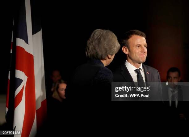 British Prime Minister Theresa May and French President Emmanuel Macron attend an official dinner at the Victoria and Albert Museum on January 18,...