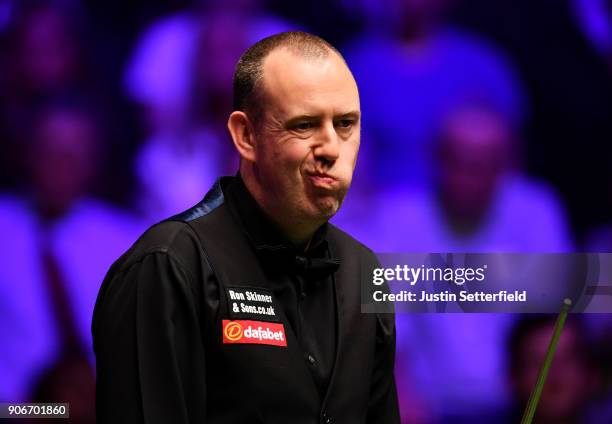 Mark Williams of Wales reacts during his match against Kyren Wilson of England during The Dafabet Masters on Day Five at Alexandra Palace on January...