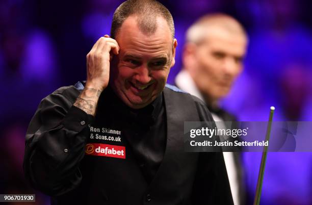 Mark Williams of Wales reacts during his match against Kyren Wilson of England during The Dafabet Masters on Day Five at Alexandra Palace on January...