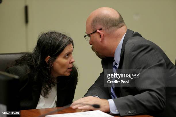 Louise Anna Turpin, accused of holding their 13 children captive, talks with her attorney Jeff Moore as she appears in court for arraignment on...