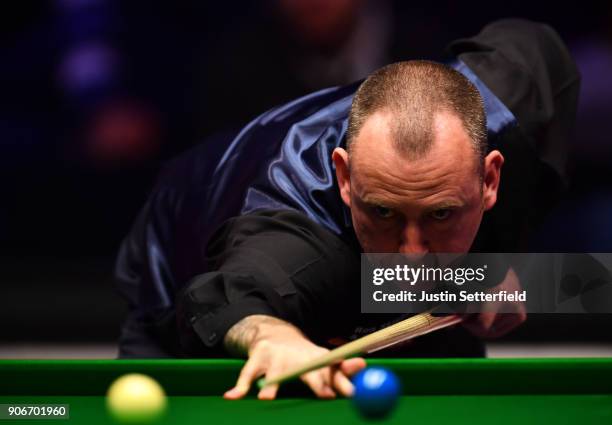 Mark Williams of Wales in action during his match against Kyren Wilson of England during The Dafabet Masters on Day Five at Alexandra Palace on...