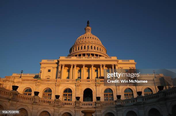 The U.S. Capitol is shown at sunset on January 18, 2018 in Washington, DC. Congress continues to wrestle with funding the federal government as...