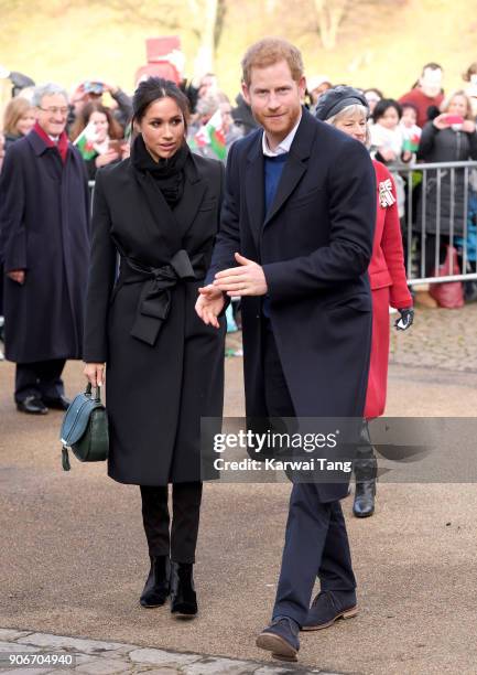 Prince Harry and fiancee Meghan Markle during a walkabout at Cardiff Castle on January 18, 2018 in Cardiff, Wales.