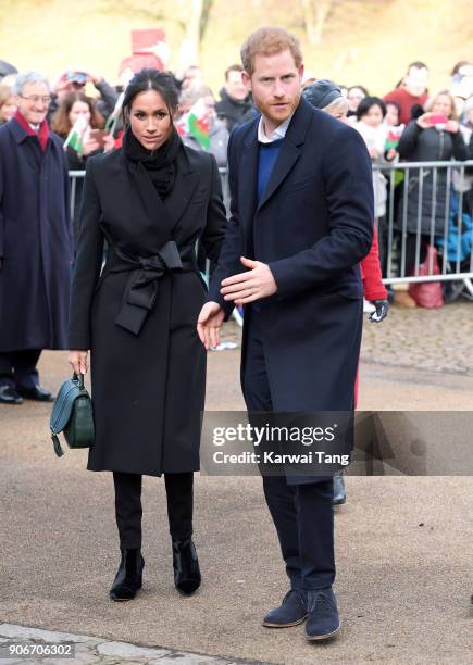 Prince Harry and fiancee Meghan Markle during a walkabout at Cardiff Castle on January 18, 2018 in Cardiff, Wales.