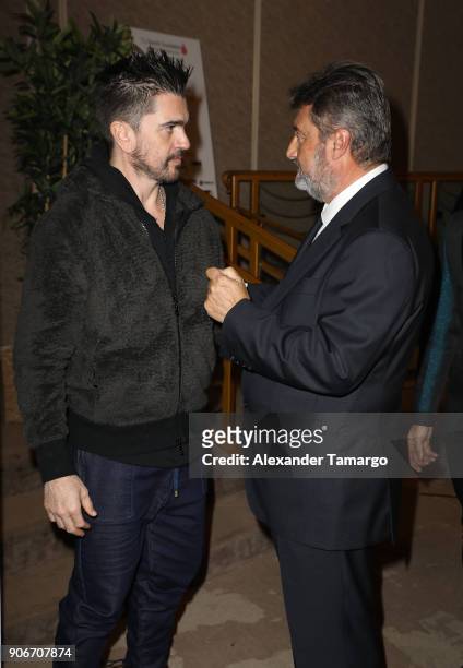 Juanes and Jesus Lopez are seen at the T.J. Martell Foundation Martell In Miami Charity Luncheon during NATPE 2018 at the Eden Roc Hotel on January...